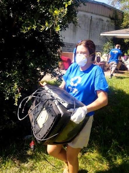 Volunteer clearing flooded home in Baton Rouge