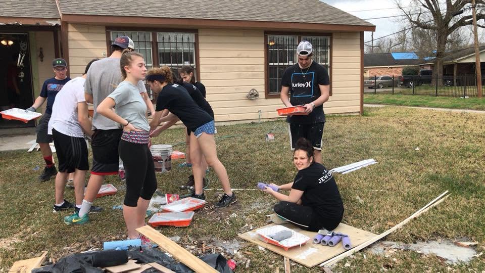 Teens painting a home in New Orleans